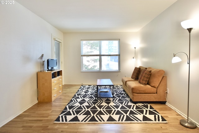 1500 SW Park Ave Unit 206, Portland, OR 97201 - living area featuring light wood-style floors and baseboards