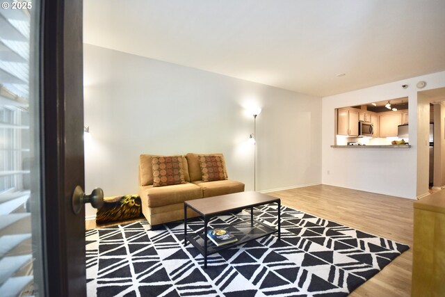 1500 SW Park Ave Unit 206, Portland, OR 97201 - living area with wood finished floors