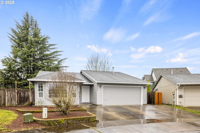 single story home with a garage, driveway, and fence