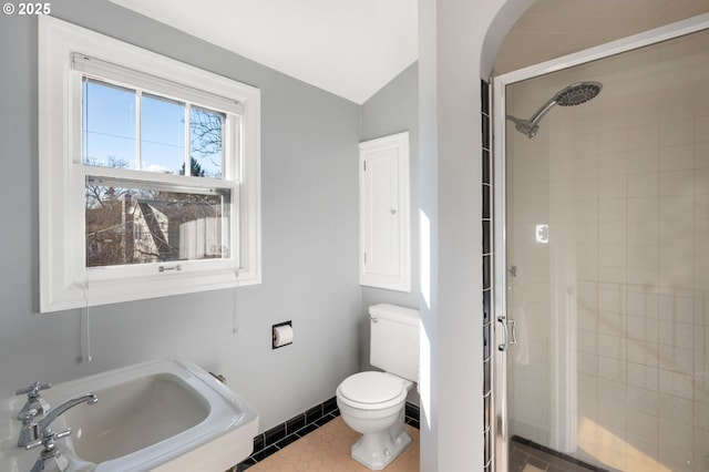7115 N Chase Ave, Portland, OR 97217 - bathroom featuring a stall shower, vaulted ceiling, and tile patterned floors
