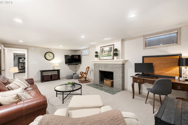 carpeted living area featuring baseboards, ornamental molding, a fireplace, and recessed lighting