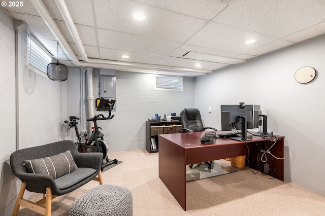 carpeted office space featuring a paneled ceiling and recessed lighting