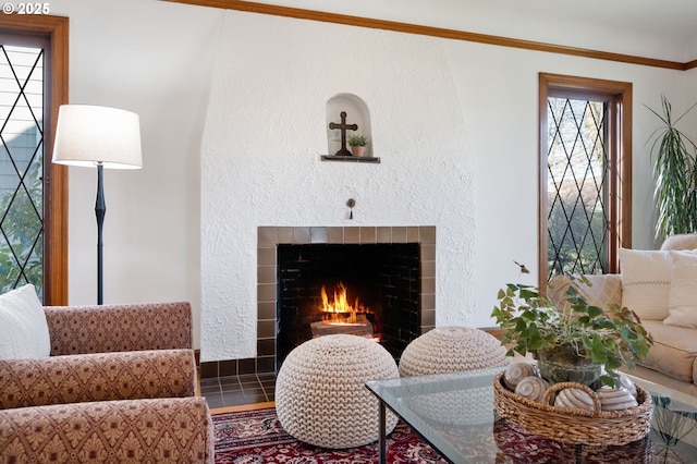 living area with a tile fireplace