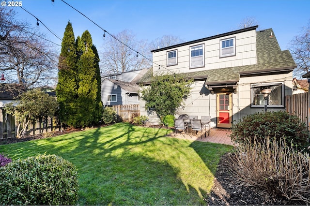 7115 N Chase Ave, Portland, OR 97217 - rear view of house with a shingled roof, a fenced backyard, and a patio area