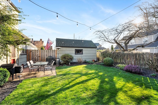 view of yard with fence and a patio