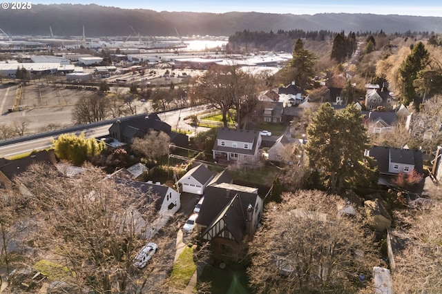 7115 N Chase Ave, Portland, OR 97217 - aerial view of property and surrounding area featuring nearby suburban area and a mountainous background
