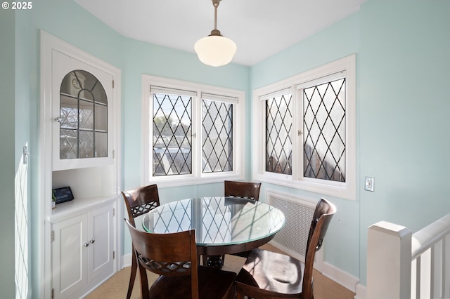 7115 N Chase Ave, Portland, OR 97217 - dining space with baseboards and light colored carpet