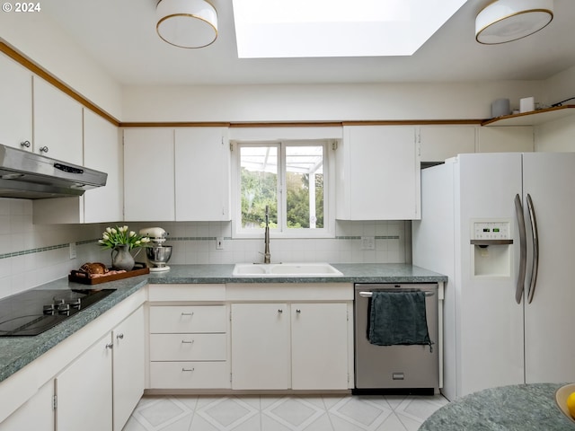 kitchen featuring under cabinet range hood, a sink, white cabinetry, stainless steel dishwasher, and white fridge with ice dispenser