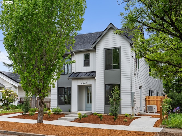 1562 NE 52nd Ave, Portland, OR 97213 - modern inspired farmhouse featuring a cooling unit, a standing seam roof, a shingled roof, and metal roof