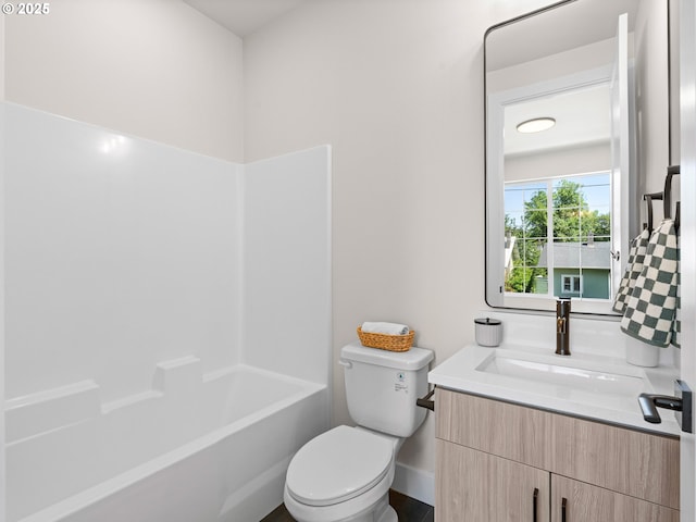 1562 NE 52nd Ave, Portland, OR 97213 - bathroom featuring vanity, toilet, shower / bathtub combination, and baseboards