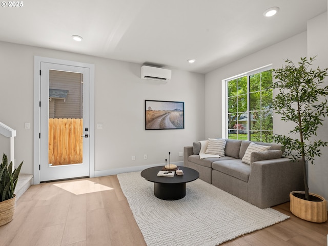 1562 NE 52nd Ave, Portland, OR 97213 - living area featuring a wall mounted air conditioner, wood finished floors, and recessed lighting