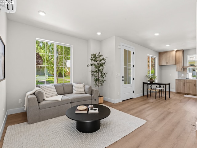 1562 NE 52nd Ave, Portland, OR 97213 - living area featuring healthy amount of natural light, light wood-style floors, recessed lighting, and baseboards