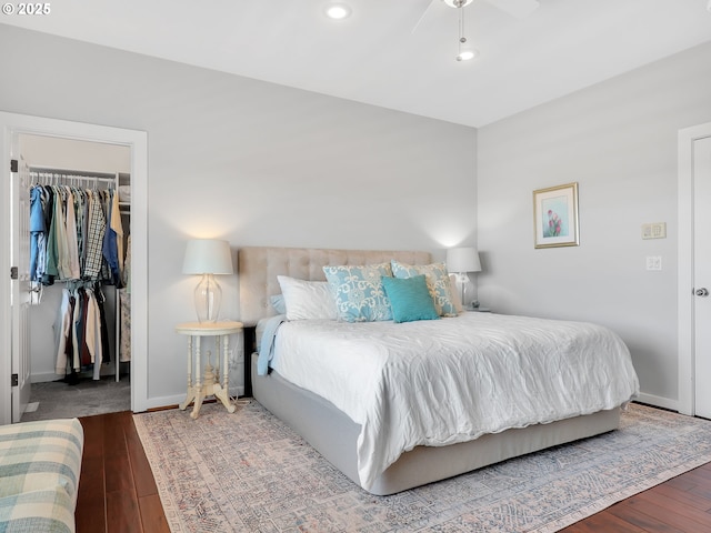 4580 Fairway Ave, Gearhart, OR 97138 - bedroom featuring a walk in closet, hardwood / wood-style flooring, a closet, baseboards, and recessed lighting