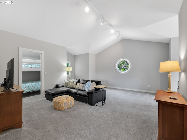 4580 Fairway Ave, Gearhart, OR 97138 - carpeted living area with rail lighting, vaulted ceiling, and baseboards