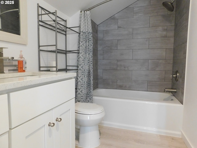 full bathroom with vanity, hardwood / wood-style floors, toilet, and shower / bath combo