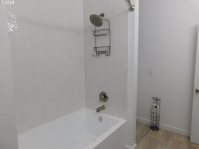 bathroom featuring hardwood / wood-style floors and shower / bath combination