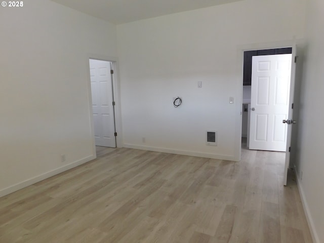 unfurnished room featuring light wood-type flooring