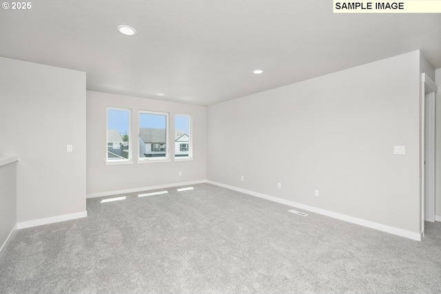 8909 S 3rd St Unit 30, Ridgefield, WA 98642 - unfurnished living room with carpet floors, baseboards, and recessed lighting