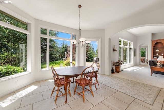 558 Wulff Ln, Roseburg, OR 97471 - dining area with plenty of natural light, arched walkways, and light tile patterned floors