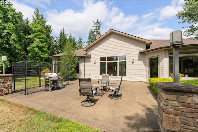 558 Wulff Ln, Roseburg, OR 97471 - rear view of property with a patio, a chimney, roof with shingles, and a gate