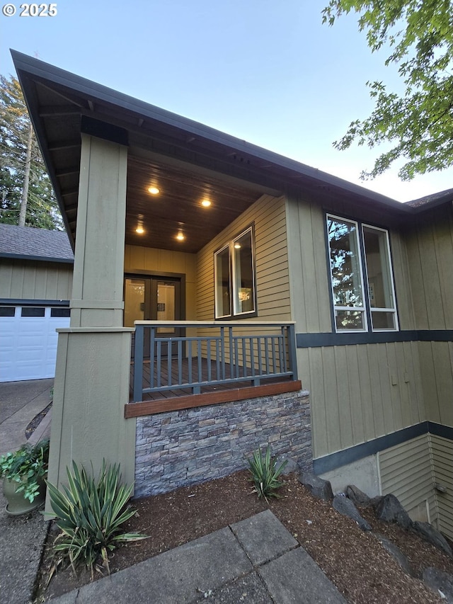 exterior space featuring a garage and a porch