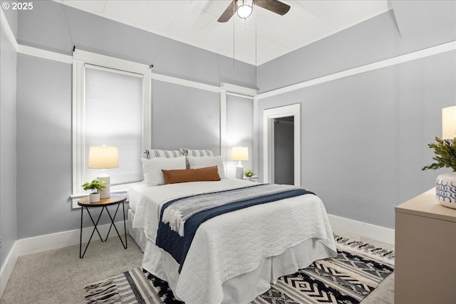 bedroom with ceiling fan and carpet floors