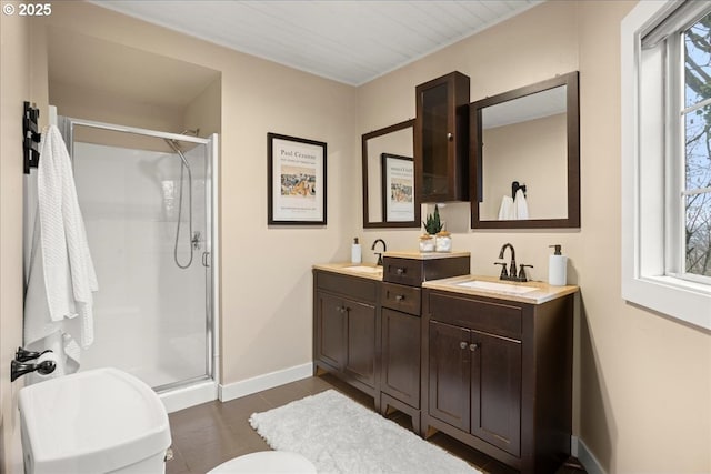 bathroom featuring an enclosed shower and vanity