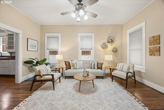 living room with ceiling fan, dark hardwood / wood-style flooring, and sink