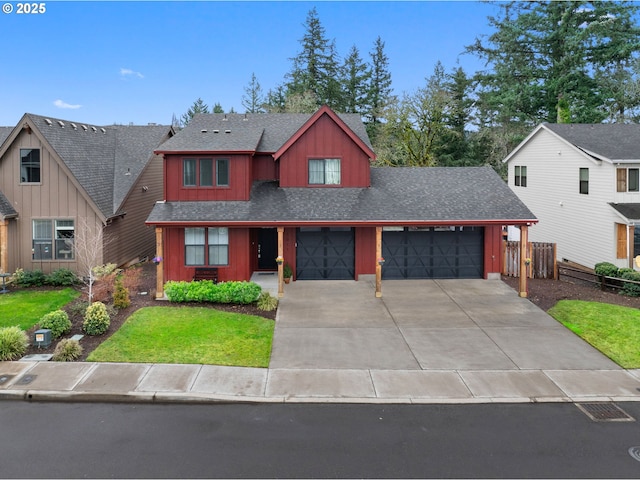 view of front of house with board and batten siding, fence, roof with shingles, a garage, and driveway