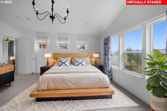 bedroom featuring multiple windows, a chandelier, and high vaulted ceiling