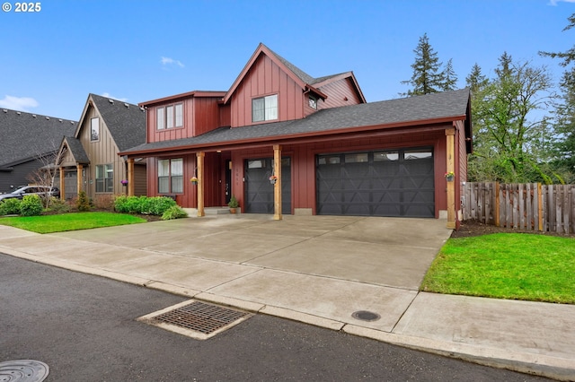 view of front facade featuring fence, roof with shingles, an attached garage, concrete driveway, and board and batten siding