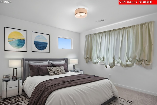 bedroom with baseboards and carpet flooring
