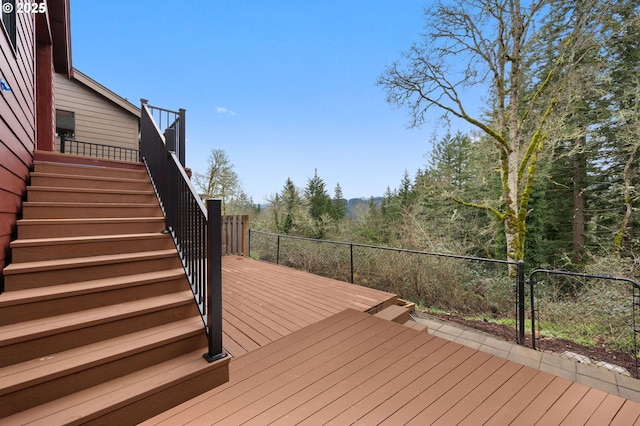 deck with stairway and fence