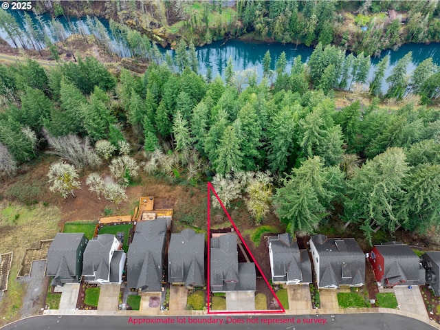 aerial view of residential area featuring property parcel outlined and a large body of water