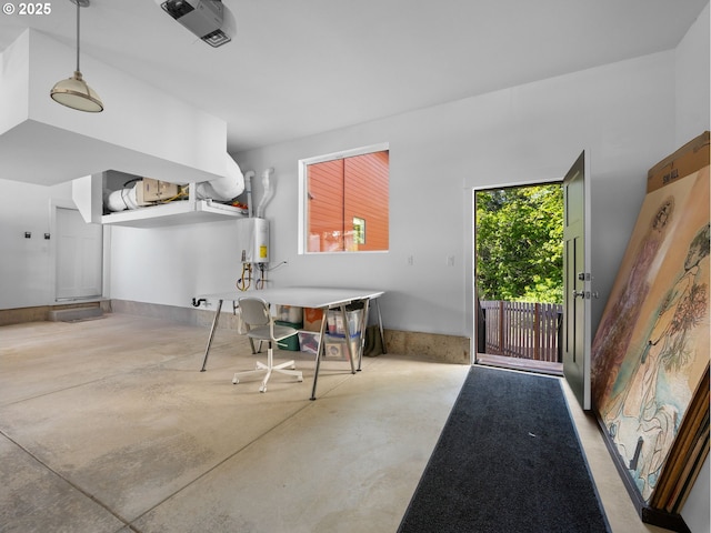 entryway with concrete flooring and water heater