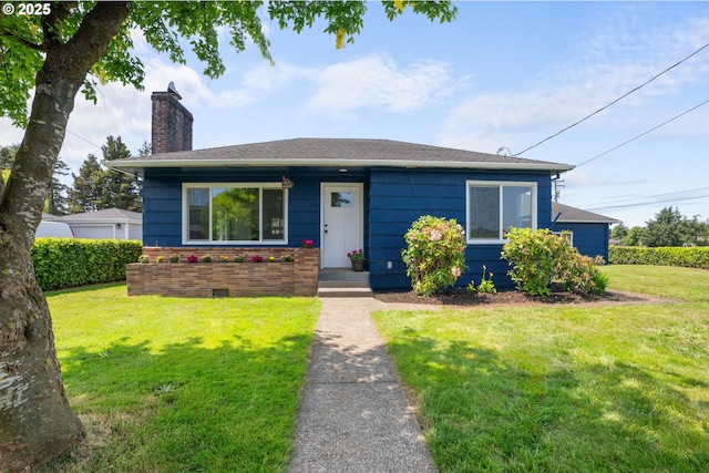 502 Williams Ave, Tillamook, OR 97141 - view of front of property with a chimney and a front lawn