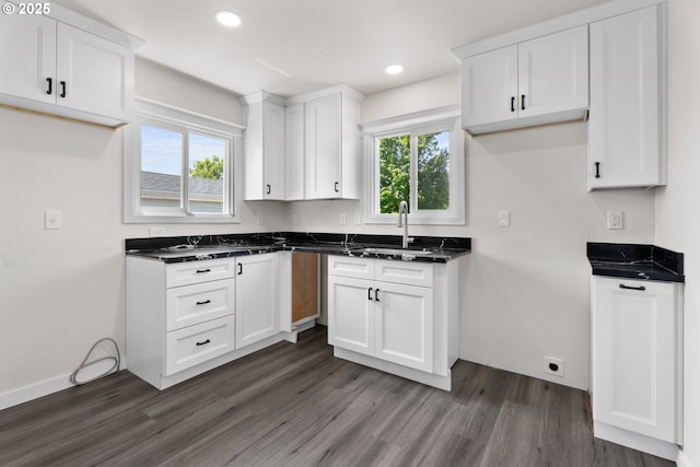 502 Williams Ave, Tillamook, OR 97141 - kitchen with a sink, dark wood-style flooring, white cabinets, recessed lighting, and baseboards