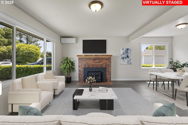 502 Williams Ave, Tillamook, OR 97141 - living room with a wall mounted air conditioner, healthy amount of natural light, wood finished floors, and baseboards