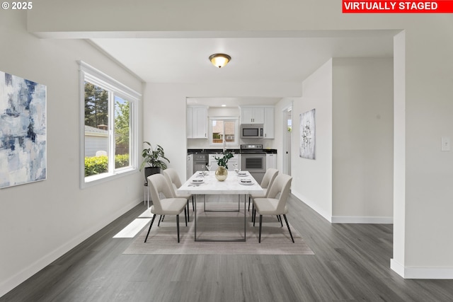 502 Williams Ave, Tillamook, OR 97141 - dining space featuring dark wood-type flooring and baseboards