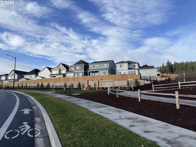 view of yard with fence and a residential view