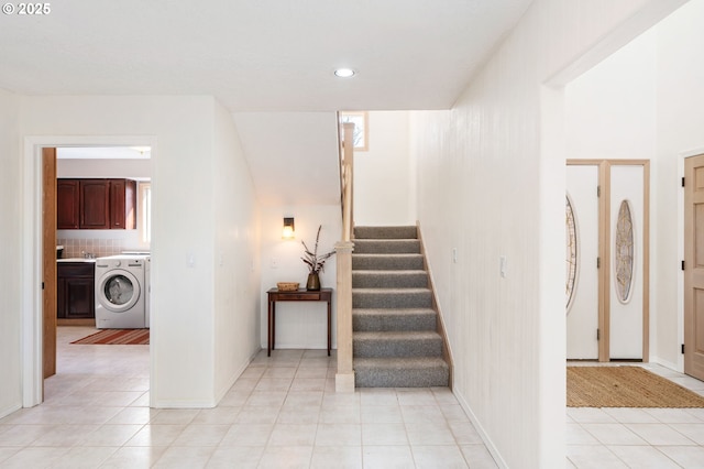 staircase featuring recessed lighting, baseboards, washer / dryer, and tile patterned flooring