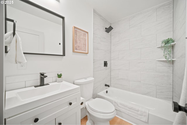 full bathroom featuring toilet, shower / bath combination, vanity, and wood finished floors