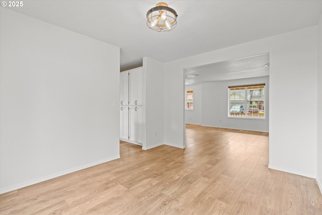 16508 NE 29th St, Vancouver, WA 98682 - empty room featuring light wood-style floors and a chandelier