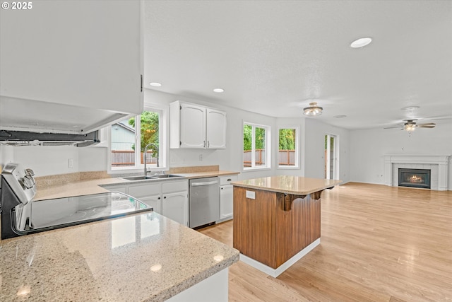 16508 NE 29th St, Vancouver, WA 98682 - kitchen featuring stainless steel dishwasher, electric range, plenty of natural light, white cabinets, and recessed lighting