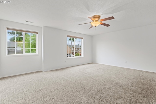 16508 NE 29th St, Vancouver, WA 98682 - spare room with plenty of natural light, carpet flooring, ceiling fan, and a textured ceiling