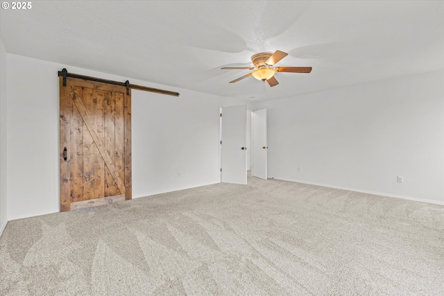 16508 NE 29th St, Vancouver, WA 98682 - unfurnished room featuring a ceiling fan, a barn door, and carpet
