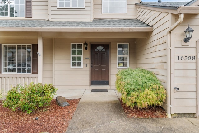 16508 NE 29th St, Vancouver, WA 98682 - doorway to property with a shingled roof and a porch