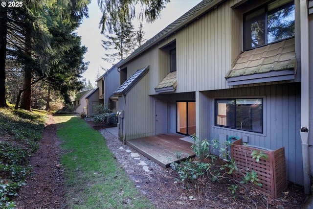 rear view of property with a wooden deck