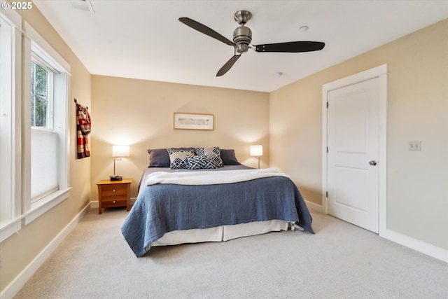 bedroom with baseboards, carpet floors, and ceiling fan