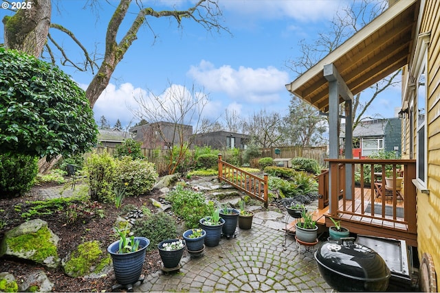 view of patio / terrace with a wooden deck and fence private yard